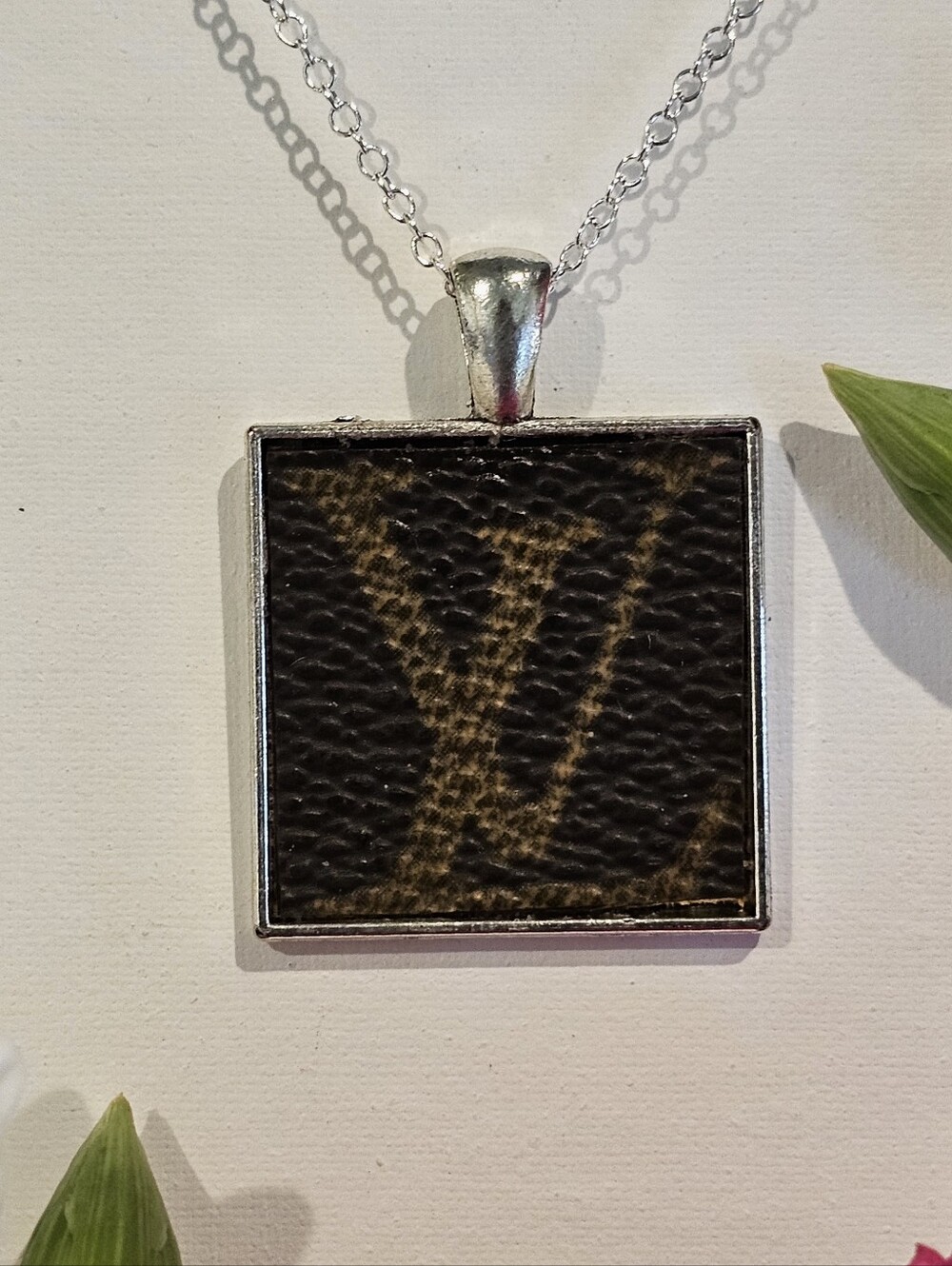 Louis Vuitton Piece in Pendant on 24" Silver Plated Necklace
